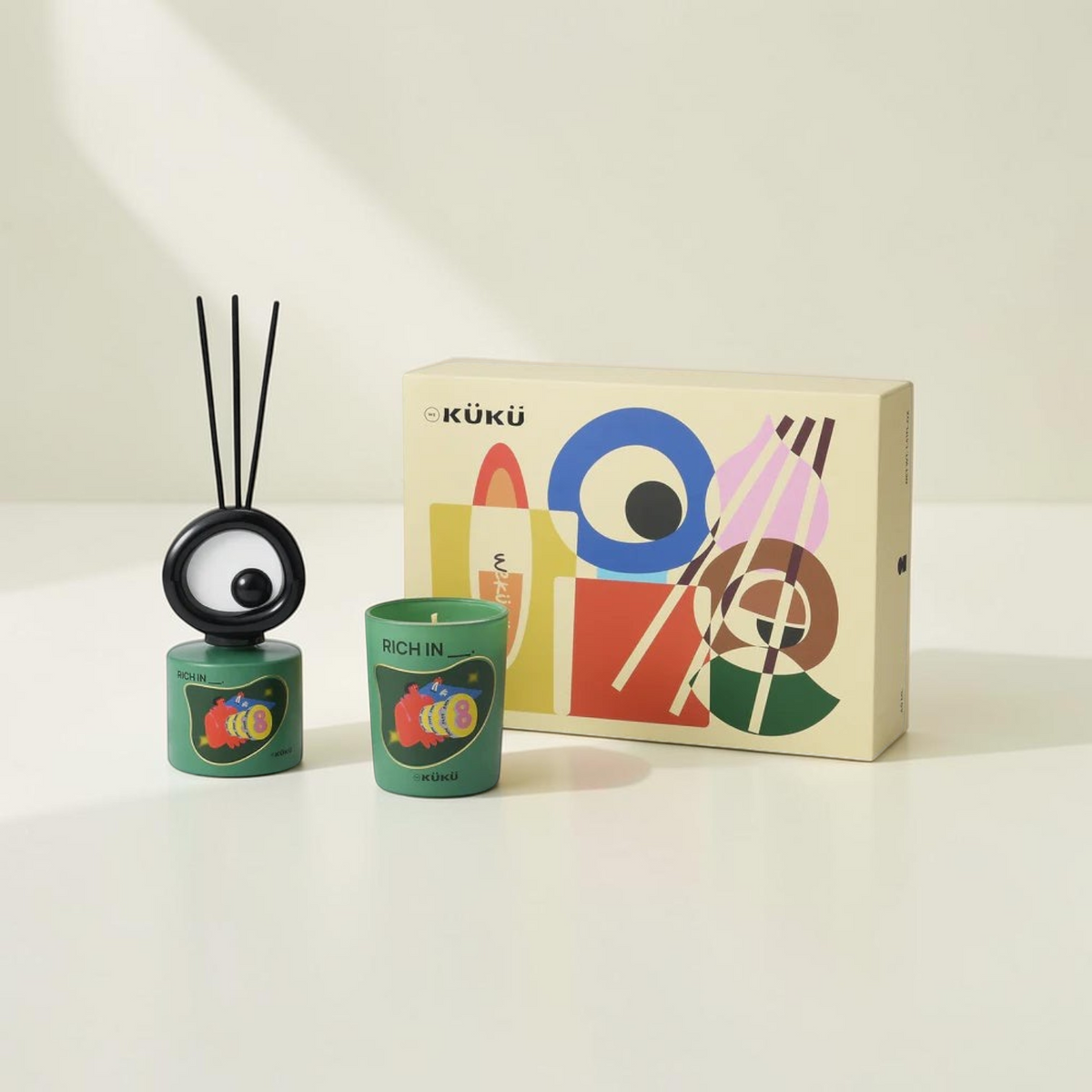Good Bounty WEKÜKÜ Big Eye woody fragrance set with a green scented candle and a unique eye-shaped diffuser in a box.