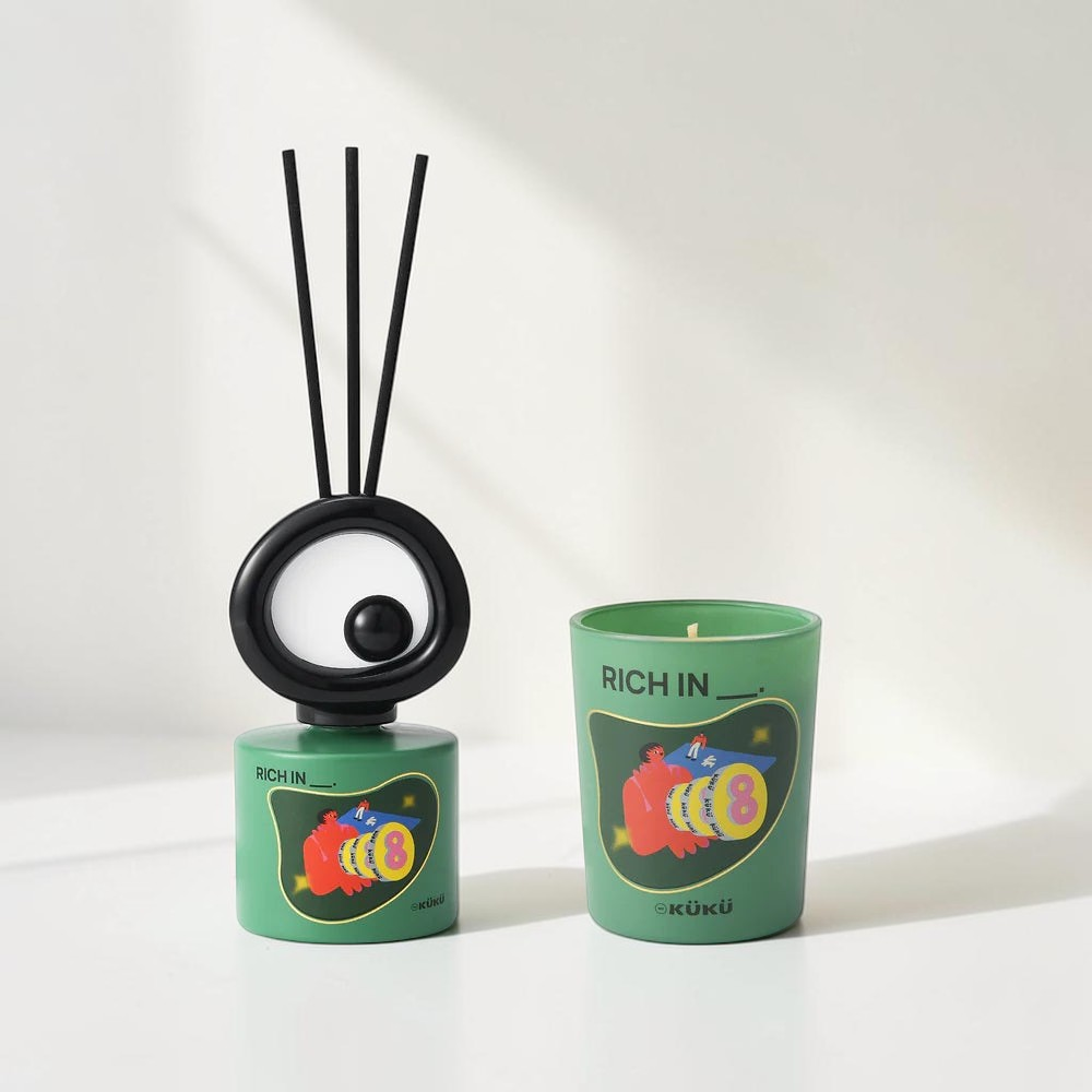Good Bounty WEKÜKÜ Big Eye woody scented candle and fragrance diffuser set in green with playful graphic design