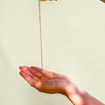 Good Bounty & Tread Well natural hand and body wash pouring into a palm with a forest-inspired silky lather
