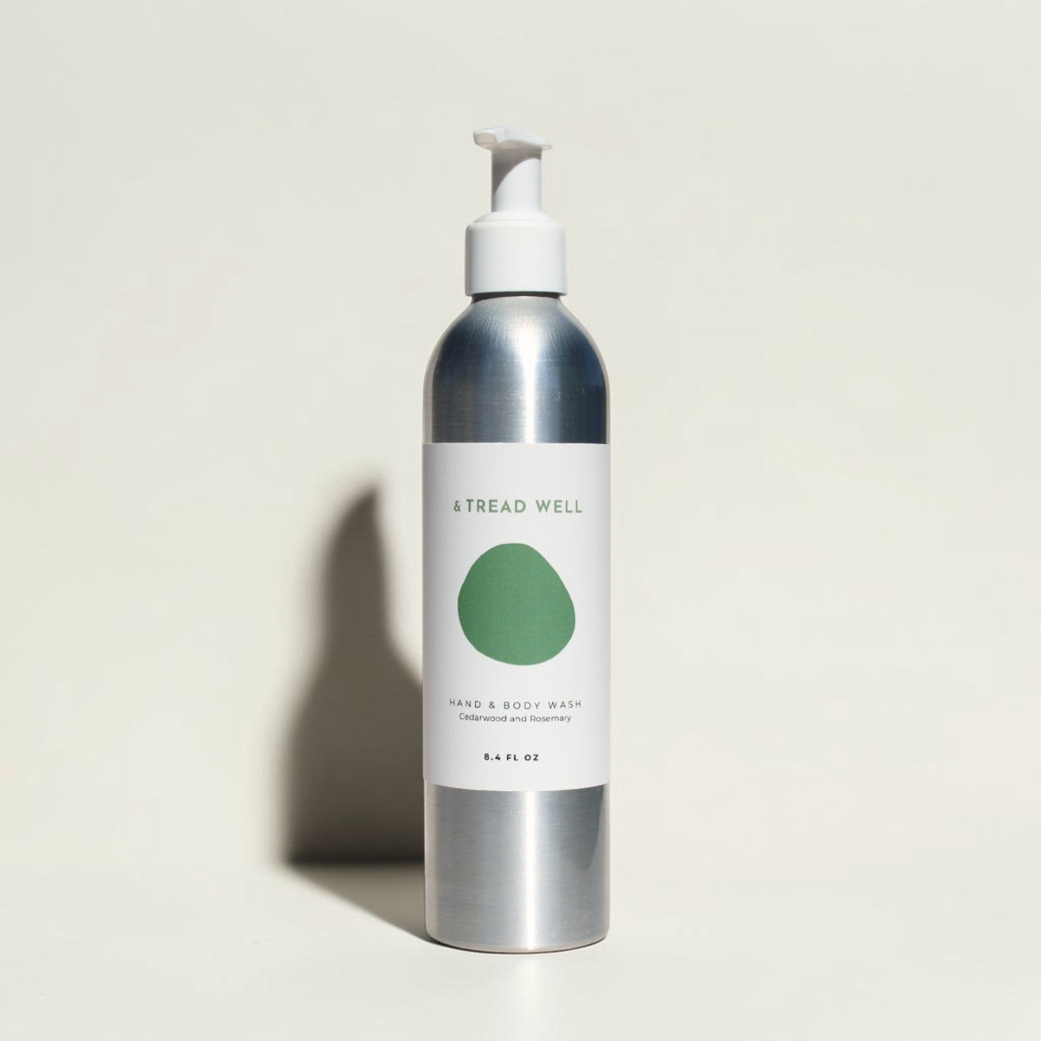 Good Bounty & Tread Well natural hand and body wash in a silver aluminum bottle with a white pump dispenser.