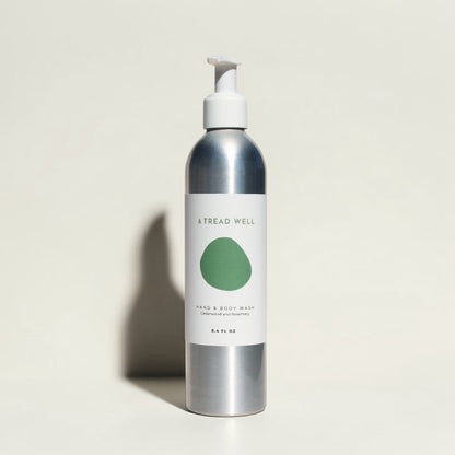 Good Bounty & Tread Well natural hand and body wash in a silver aluminum bottle with a white pump dispenser.